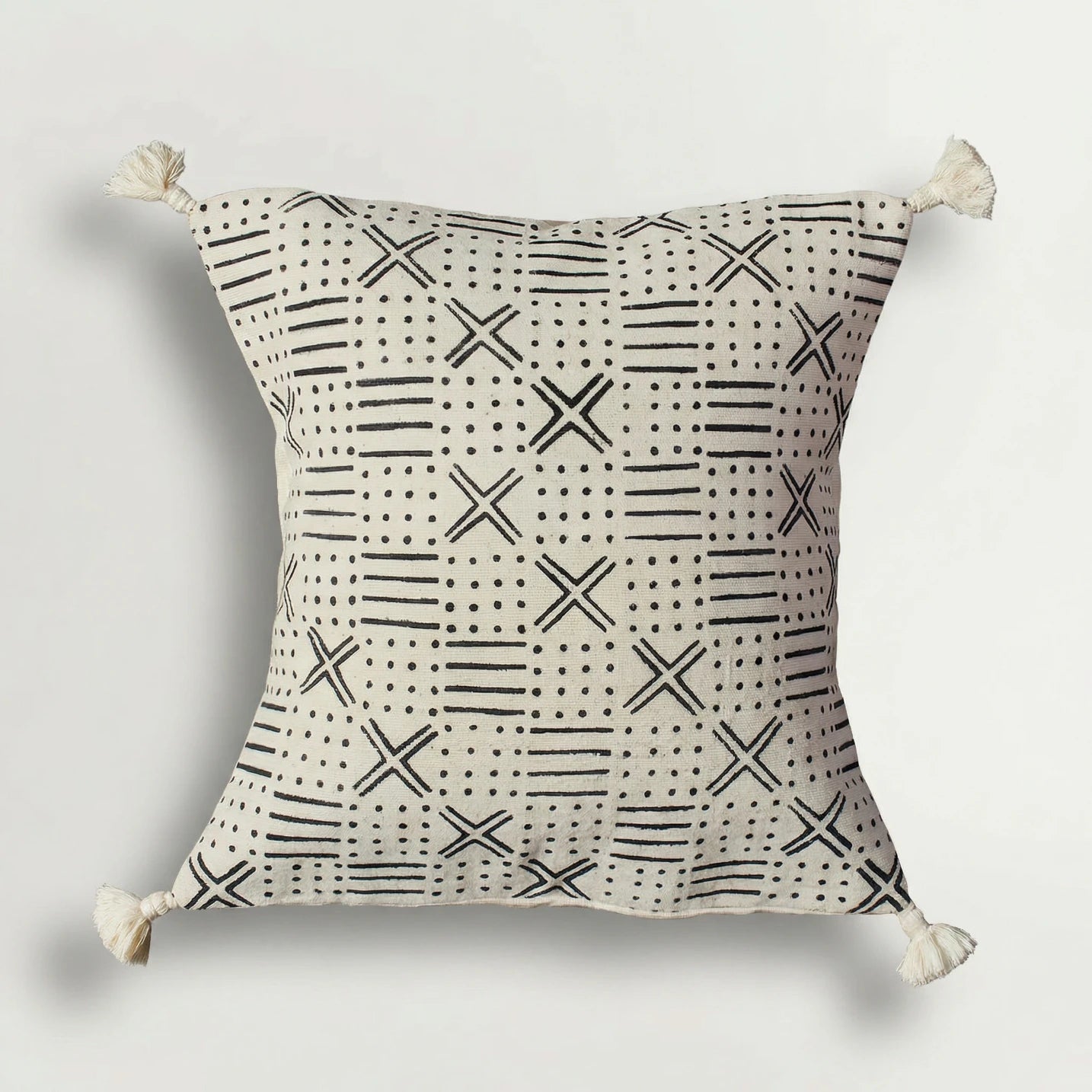 Decorative pillow with black geometric pattern on a light gray background