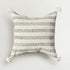 Decorative pillow with black arrow pattern on a white background