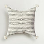 Decorative pillow with black arrow pattern on a white background