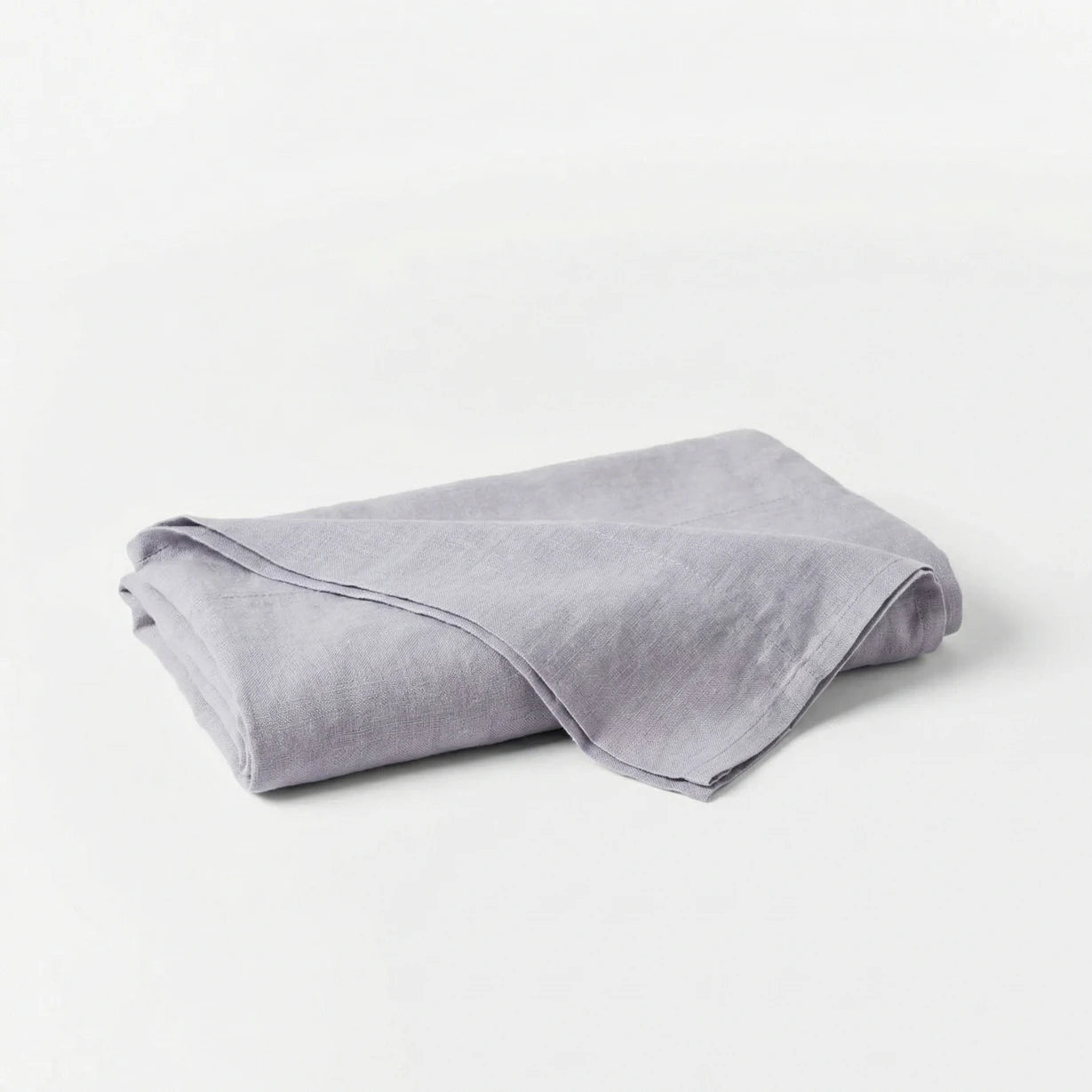 Folded gray blanket on a white background