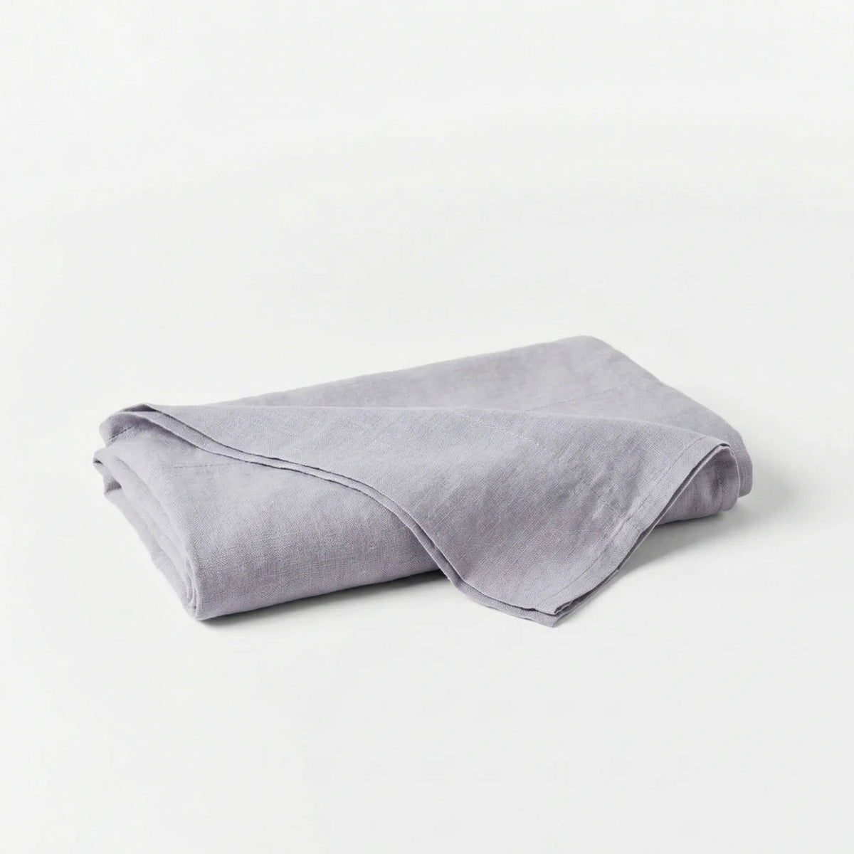 Folded gray blanket on a white background