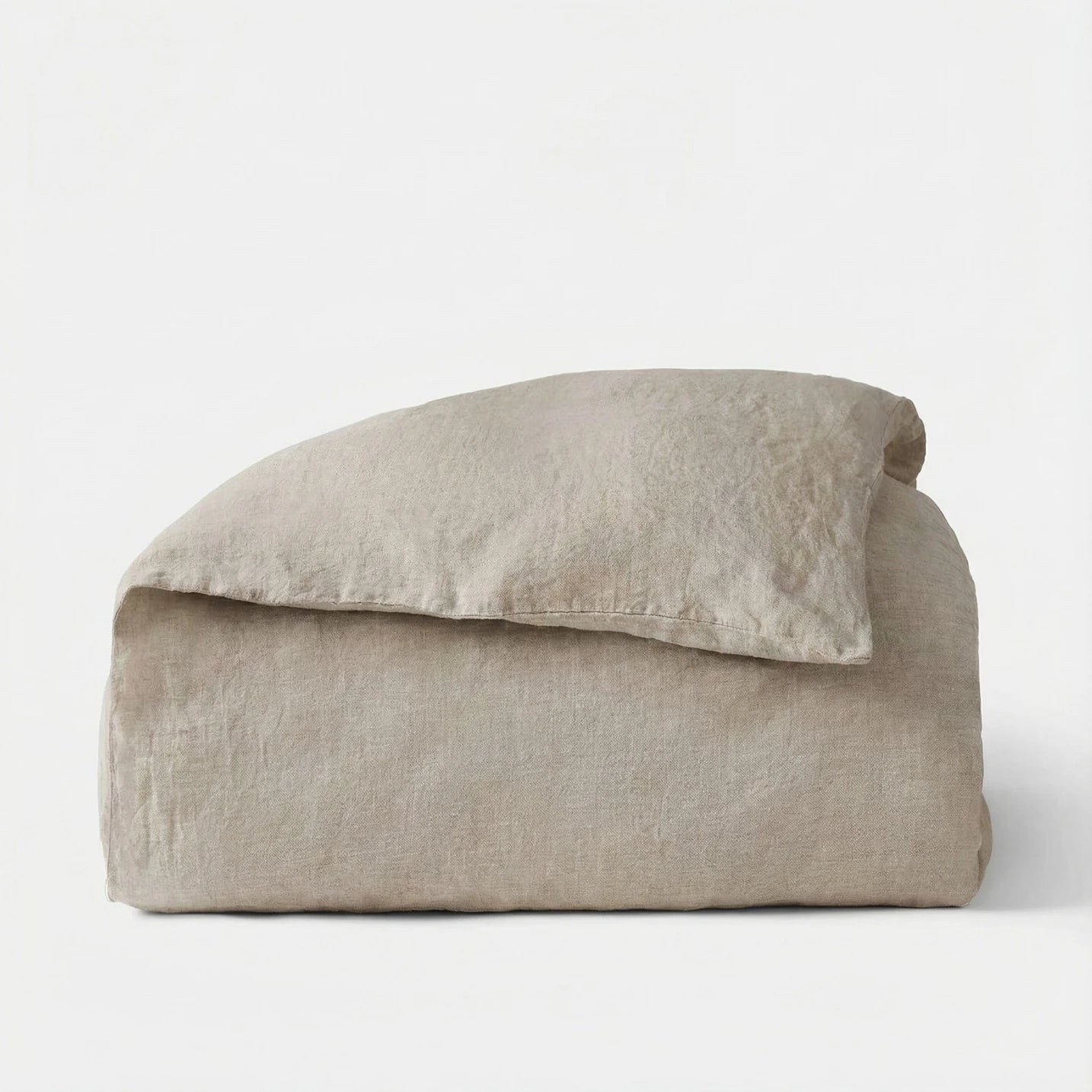 Beige pillow and blanket set on a white background