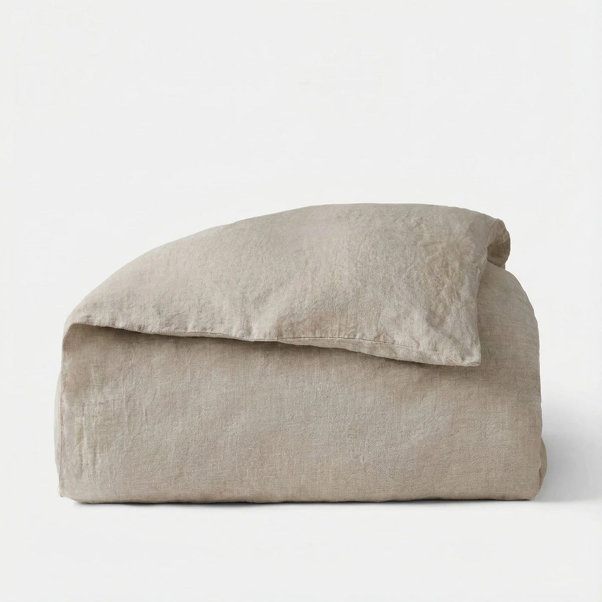Beige pillow and blanket set on a white background