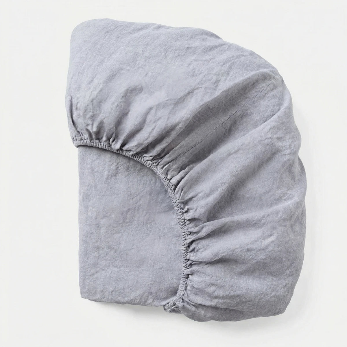Gray fitted sheet on a white background