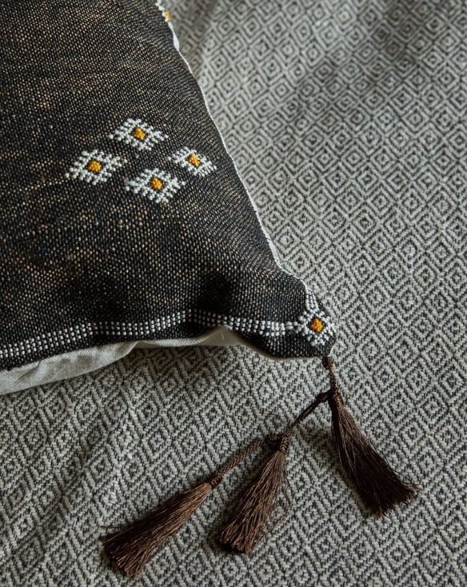 close up of embroidery and tassels on Moroccan cactus silk pillow