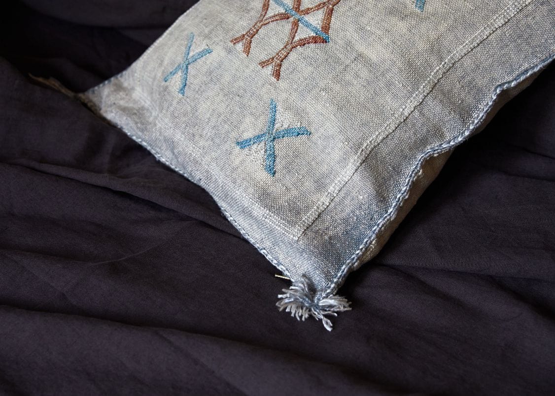 right side view of light blue Sabra pillow