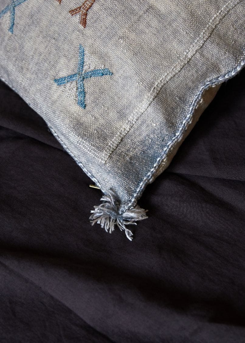 close up of corner tassel on light blue Princess Sabra pillow